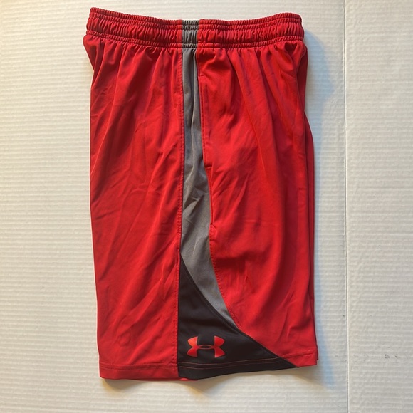 Under Armour red athletic shorts with black and grey on side of shorts. - Picture 4 of 5